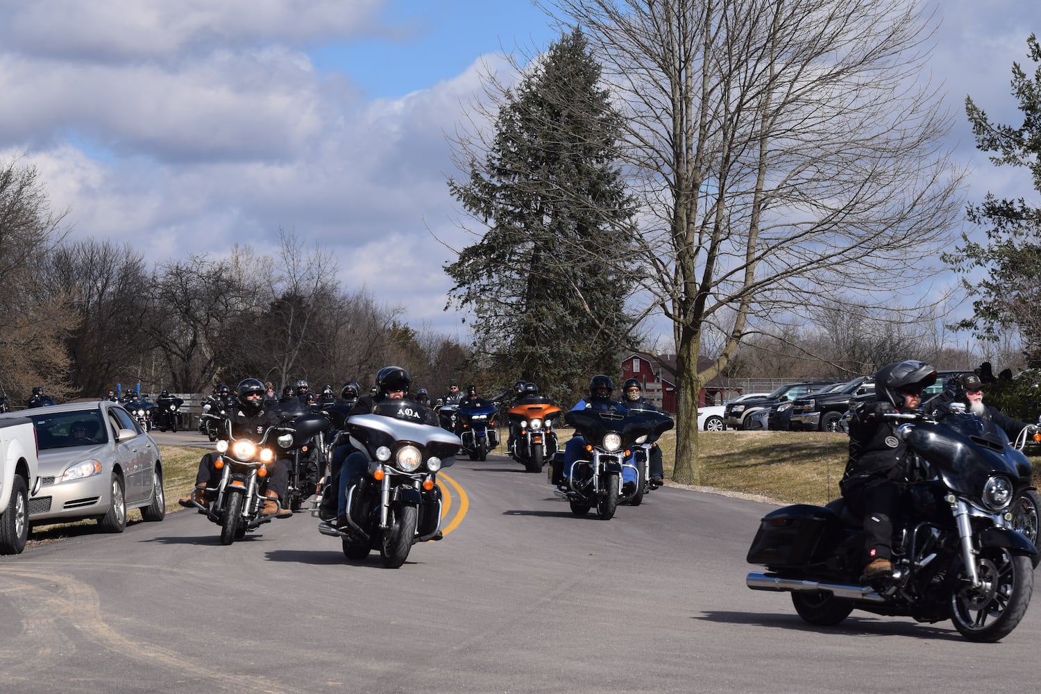 PHOTOS: Thousands of Outlaws attend motorcycle gang leaders funeral at Montgomery County Fairgrounds.