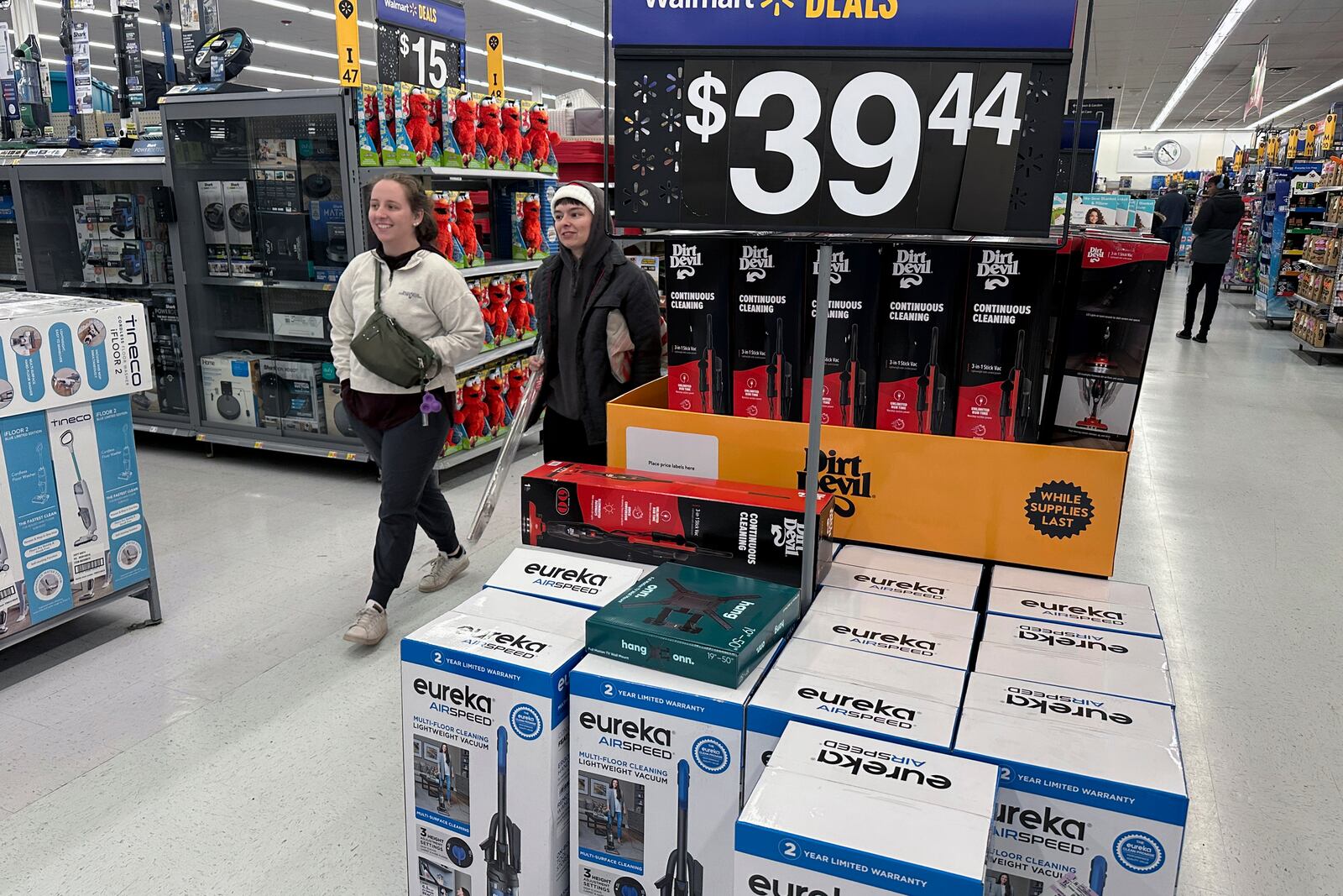 FILE - People shop for Black Friday deals at a Walmart store in Rochester, New York on Friday, November 29, 2024. (AP Photo/Ted Shaffrey, File)