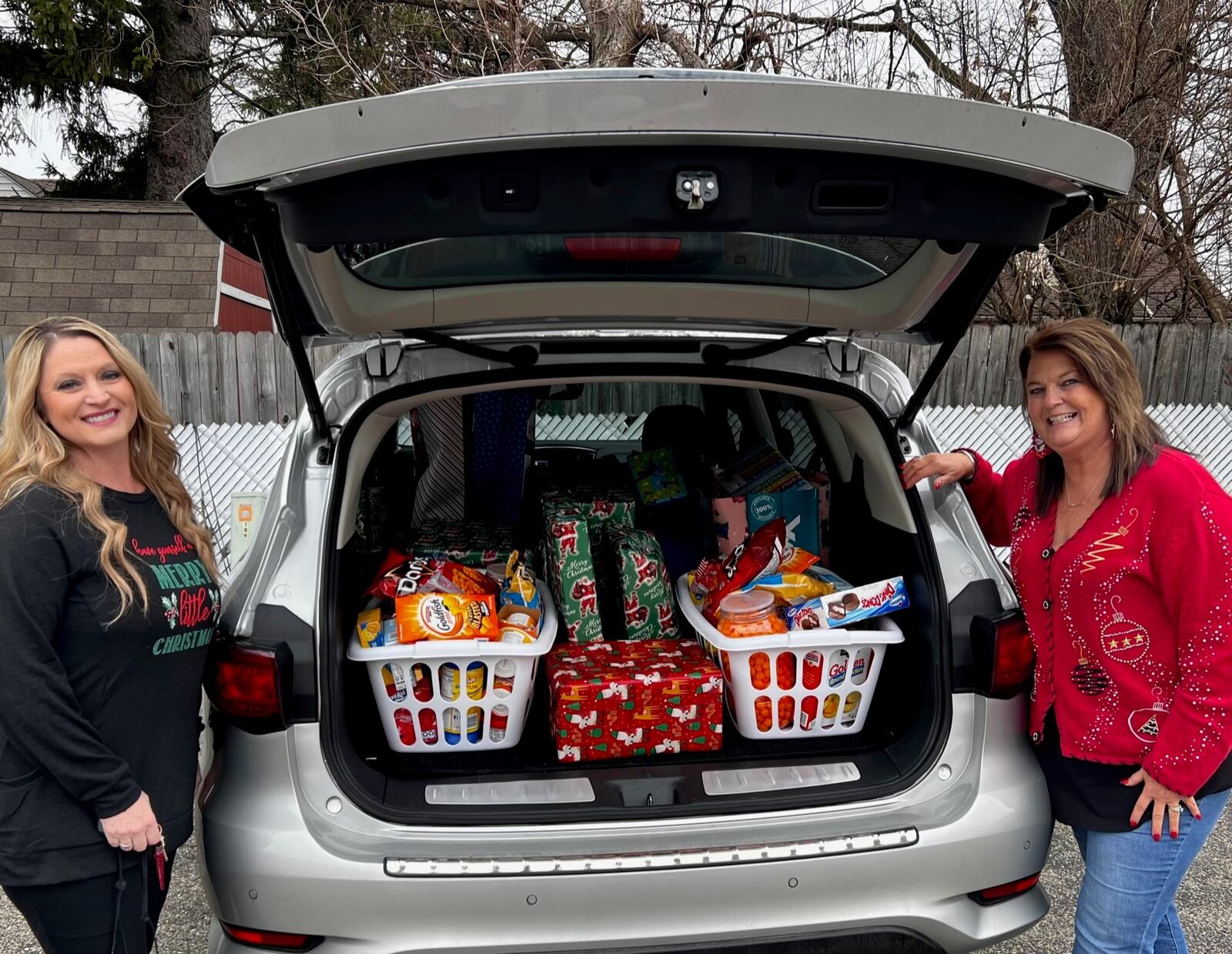 Lisa Kee of State Farm and Debbie Kemper were among the more than 140 sponsors and volunteers who helped in the gift giveaway organized from Carlisle resident and Stebbins High School grad Kim Bilbrey. CONTRIBUTED