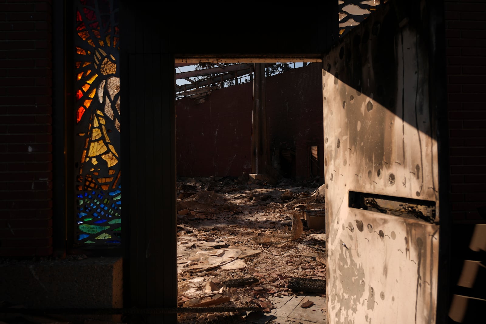 Corpus Christi Church destroyed by the Palisades Fire is seen in Palisades, Calif., Wednesday, Jan. 15, 2025. (AP Photo/Jae C. Hong)