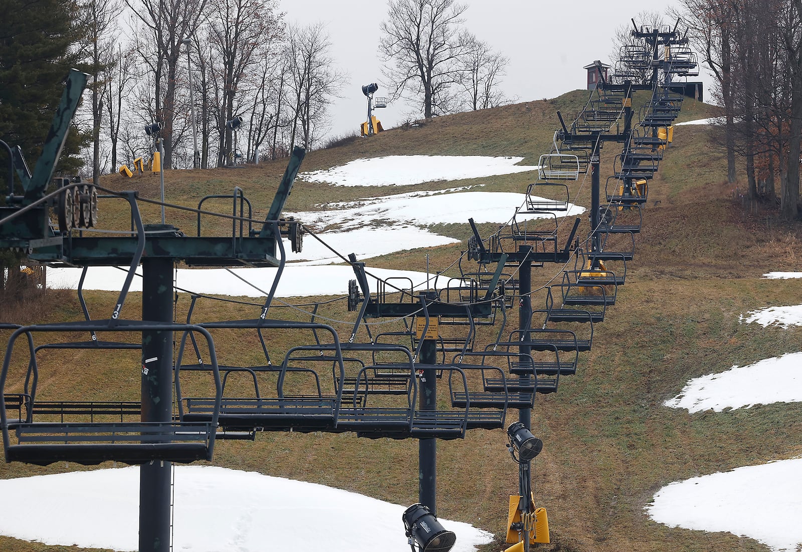 The chair lifts at Mad River Mountain in Logan County are silent Tuesday, Dec. 26, 2023 as temperatures reached the mid 50's. BILL LACKEY/STAFF