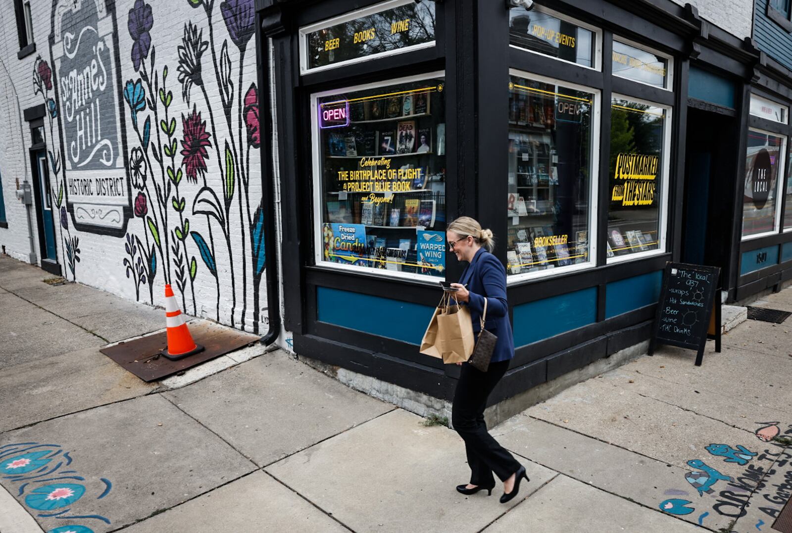 A customer leaves The Local 937 on Fifth Street in the St. Anne's Hill district Wednesday September 25, 2024. JIM NOELKER/STAFF