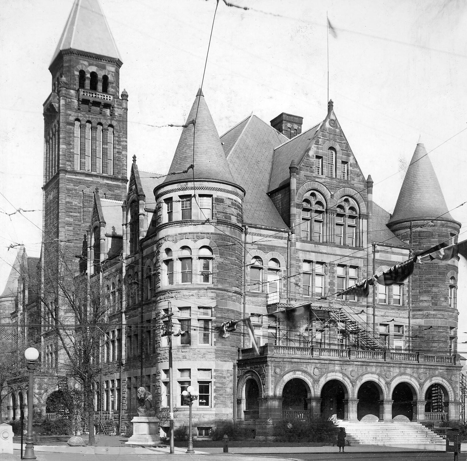 Leo the Lion was commissioned for Steele High School in Dayton in 1907 and unveiled the following year. The sculpture of the lion sat at the corner of the school (left) until it was relocated in 1955. DAYTON DAILY NEWS ARCHIVE