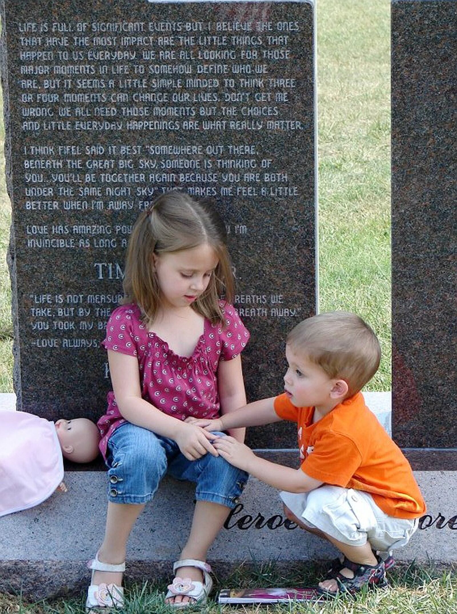 Lily and Noah Hines at the graveside of their father, Army Pfc. Tim Hines, who died in 2005 from injuries sustained in an explosion in Iraq.