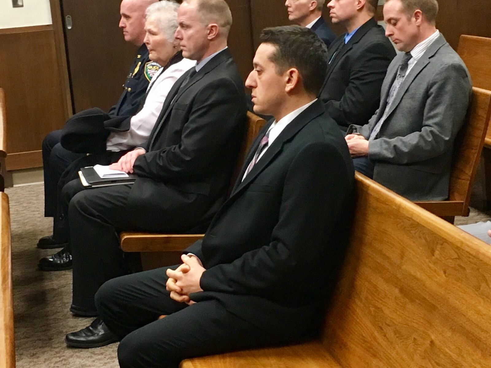 Former Kettering police detective Ryan Meno waits in court before he was sentenced for theft of drugs, theft in office and obstruction of justice after he admitted to stealing pain pills from an elderly woman’s home.