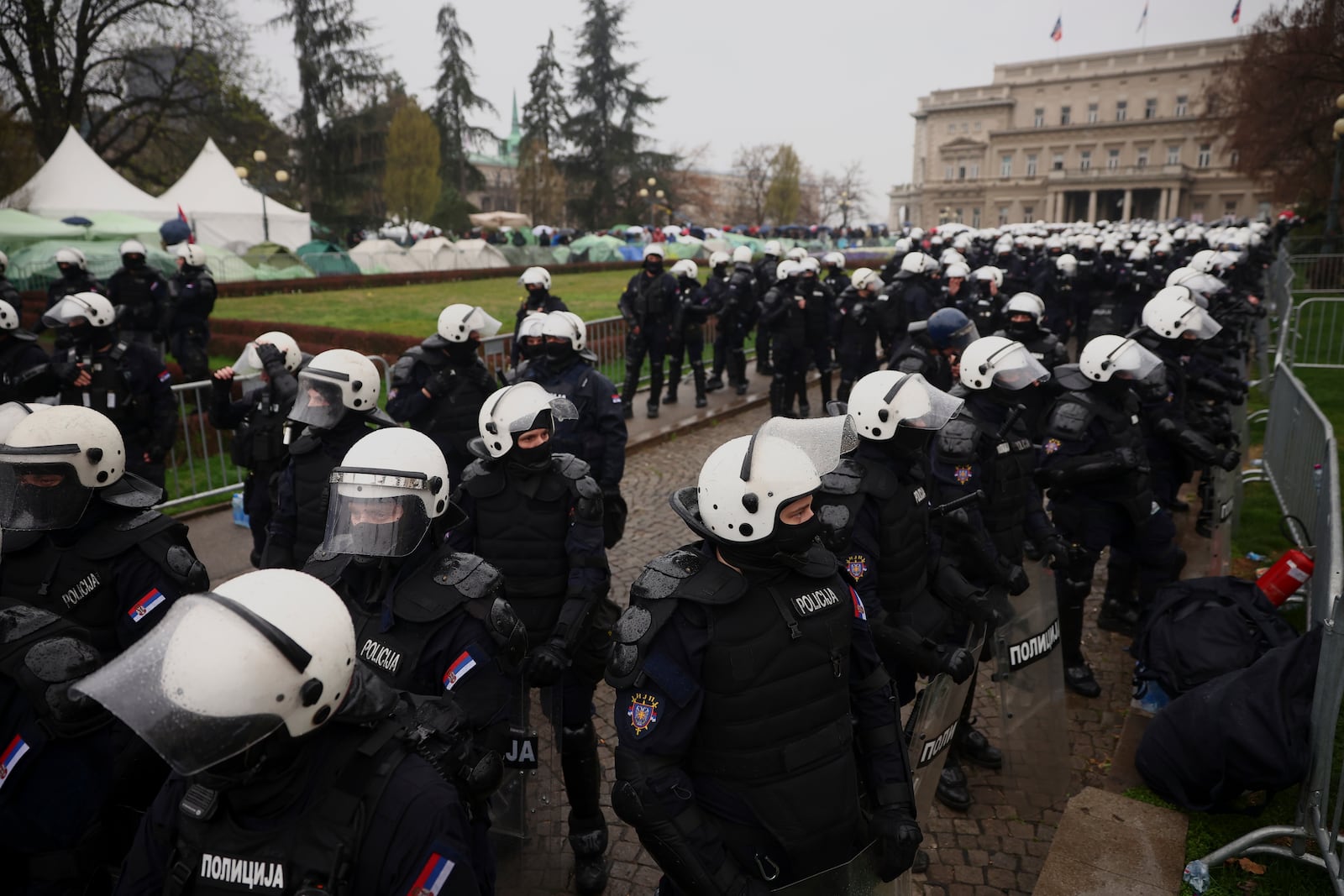 Anti-riot police cordons off the area near the Parliament building during a major rally against populist President Aleksandar Vucic and his government, in downtown Belgrade, Serbia, Saturday, March 15, 2025. (AP Photo/Armin Durgut)