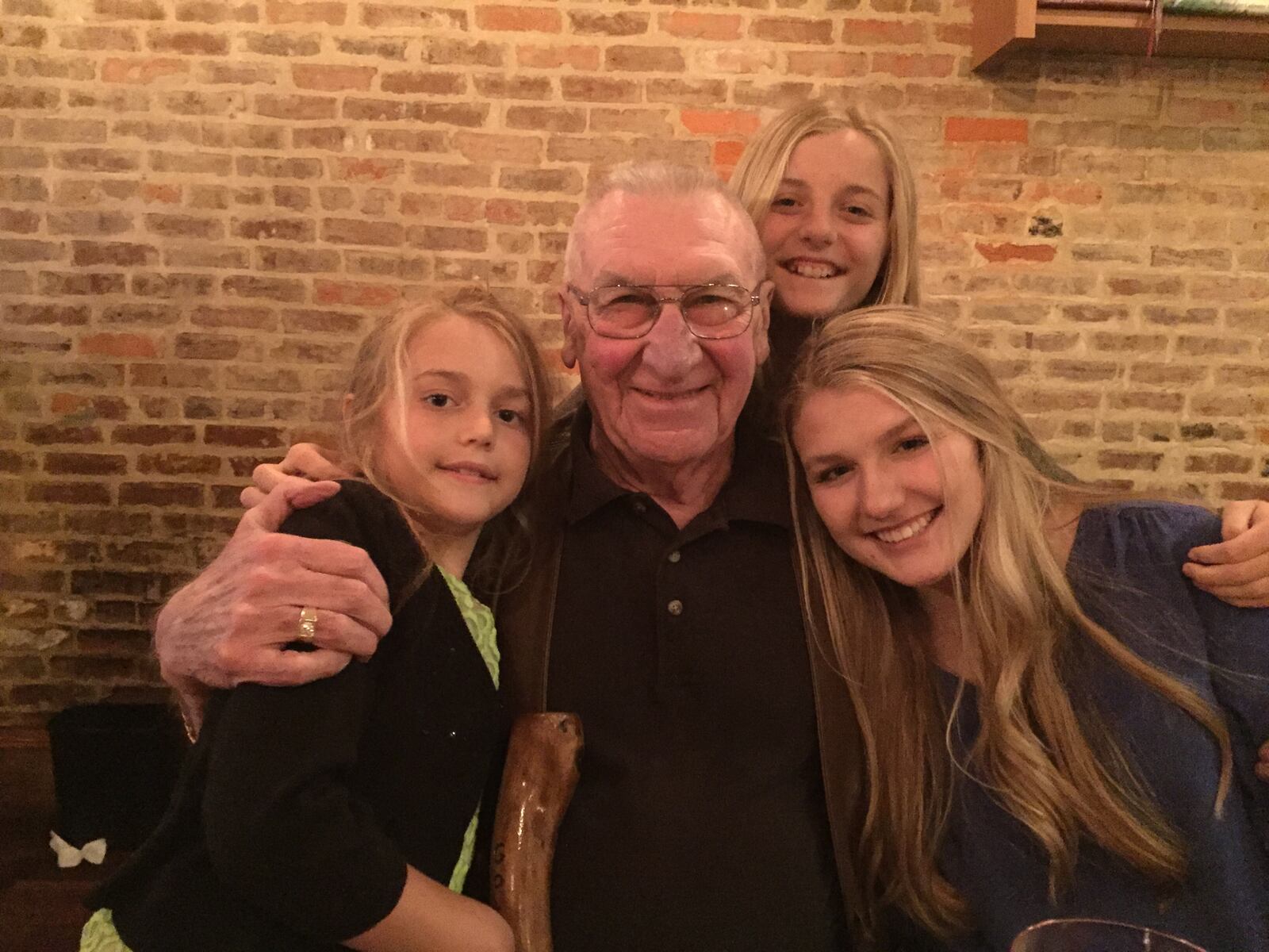 Former South High School Athletic Director C. Duane Baker is pictured with his three granddaughters: Vivianna, left; Avamarie, top middle; and Isabella, right