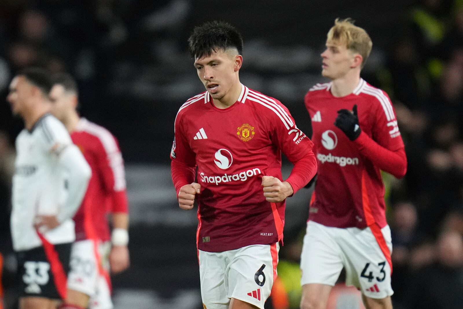 Manchester United's Lisandro Martinez celebrates scoring his side's opening goal during the English Premier League soccer match between Fulham and Manchester United at Craven Cottage stadium in London, Sunday, Jan. 26, 2025. (AP Photo/Kirsty Wigglesworth)