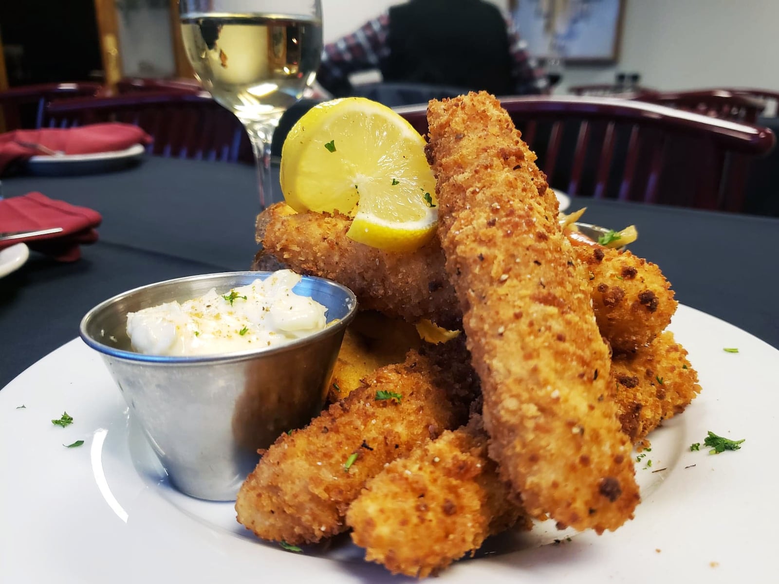 The Potato Crusted Cod and Tavern Chips is one of the entrees offered on The Bison & The Boar's new comfort food menu. The dish is a version of a classic, fish and chips, served with a side of charred apple slaw and house-made tartar sauce. CONTRIBUTED