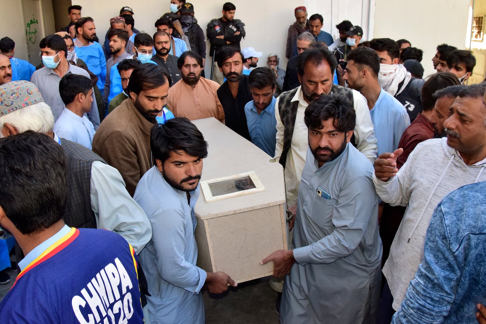 Relatives carry a body of the victim of a bomb explosion at railway station, after receiving it from a hospital, in Quetta, southwestern Pakistan, Saturday, Nov. 9, 2024. (AP Photo/Arshad Butt)