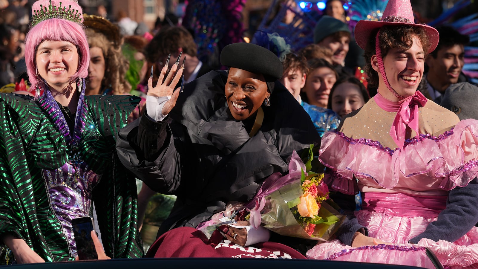 Harvard University's Hasty Pudding Theatricals Woman of the Year Cynthia Erivo rides with two character actors during a parade in her honor, Wednesday, Feb. 5, 2025, in Cambridge, Mass. (AP Photo/Charles Krupa)