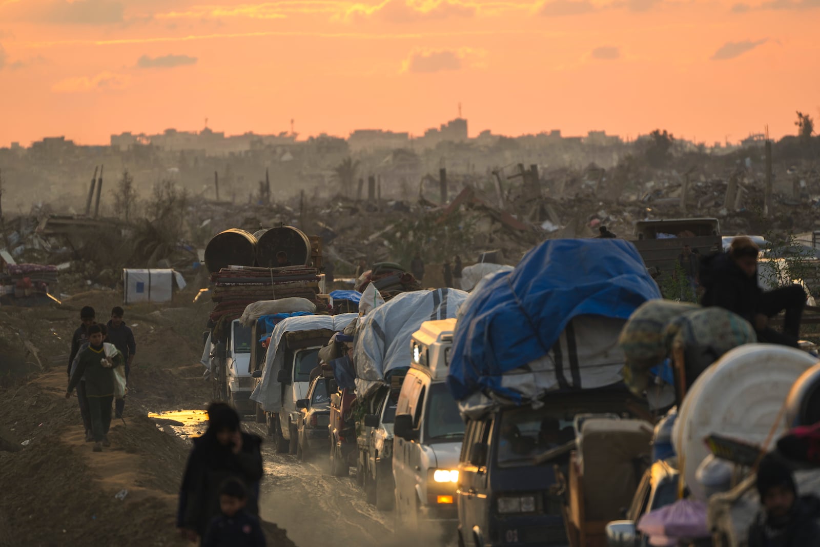 Displaced Palestinians make their way from central Gaza to their homes in the northern Gaza Strip, Monday, Feb. 10, 2025. (AP Photo/Abdel Kareem Hana)