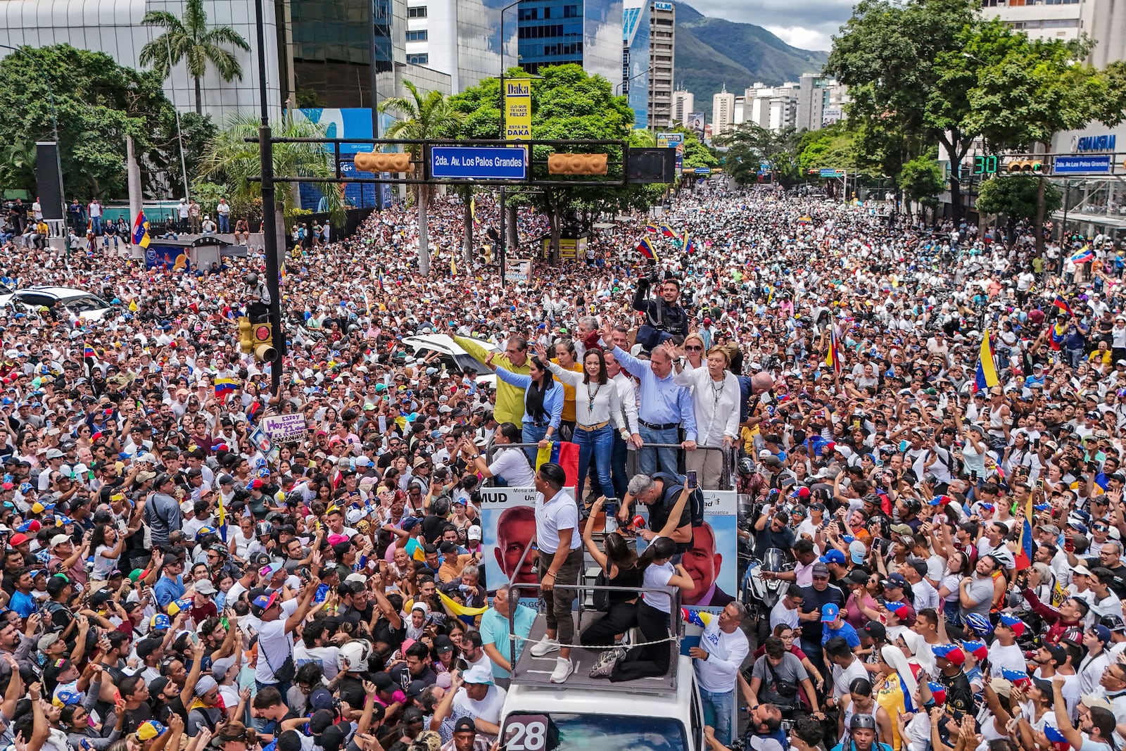 FILE - Opposition leader Maria Corina Machado and opposition candidate Edmundo Gonzalez ride atop a truck during a protest against official presidential election results declaring President Nicolas Maduro the winner in Caracas, Venezuela, July 30, 2024, two days after the vote. (AP Photo/Matias Delacroix, File)