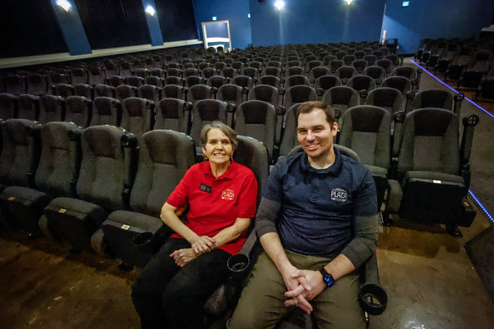 Plaza Theatre Manager Linda Wright and Executive Director Chris Sedlak sit in the Plaza Theatre seats Thursday, January 12, 2023. The Miamisburg movie theater had its most successful year in 2022 and is introducing even more promotional events this year. JIM NOELKER/STAFF