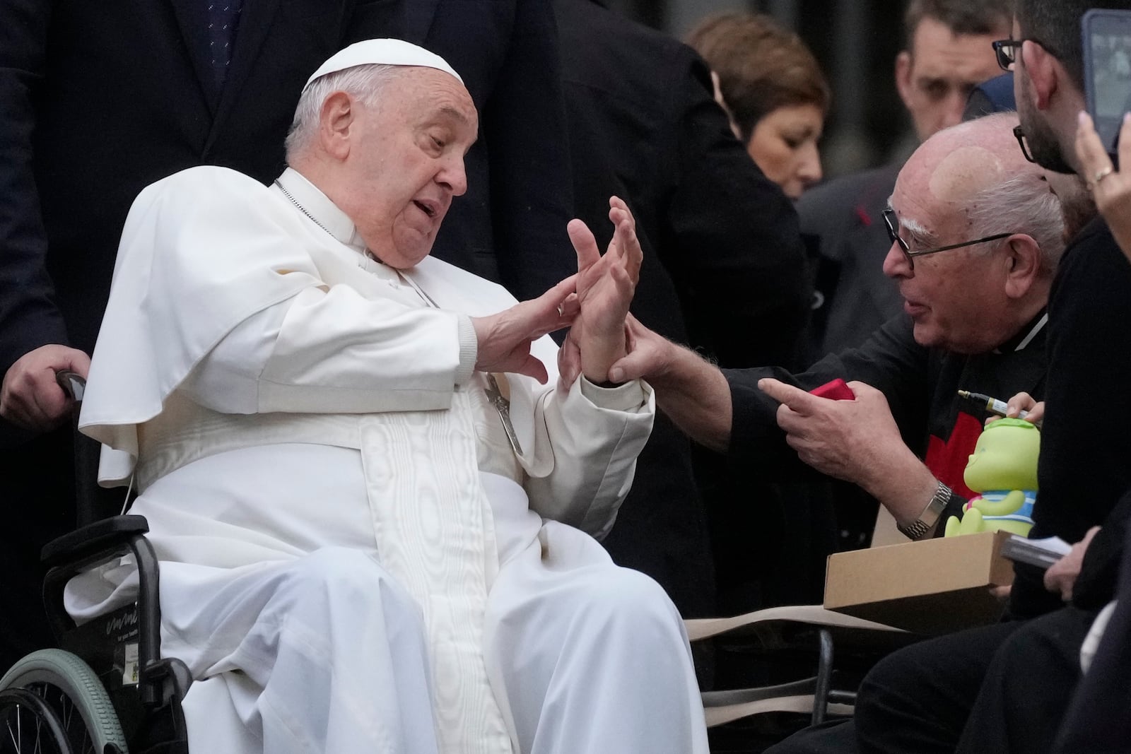 Pope Francis greets faithful during his weekly general audience in St. Peter's Square at The Vatican, Wednesday, Nov.20, 2024. (AP Photo/Gregorio Borgia)