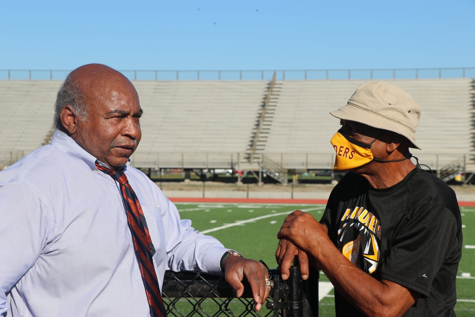 Pro Football Hall of Famer Willie Lanier (left)) and Central State assistant football coach George Ragsdale stand alongside the new turf field at McPherson Stadium. Lanier grew up in Clover, Virginia and Rasdale grew up 80 miles away in Dinwiddie. Va.  Ragsdale idolized the older football Lanier. Both went to HBCU’s and then on to the NFL, Lanier for 11 years with the Kansas City Chiefs and Ragsdale for three years with Tampa Bay. Photo courtesy of Nick Novy/Central State Athletics