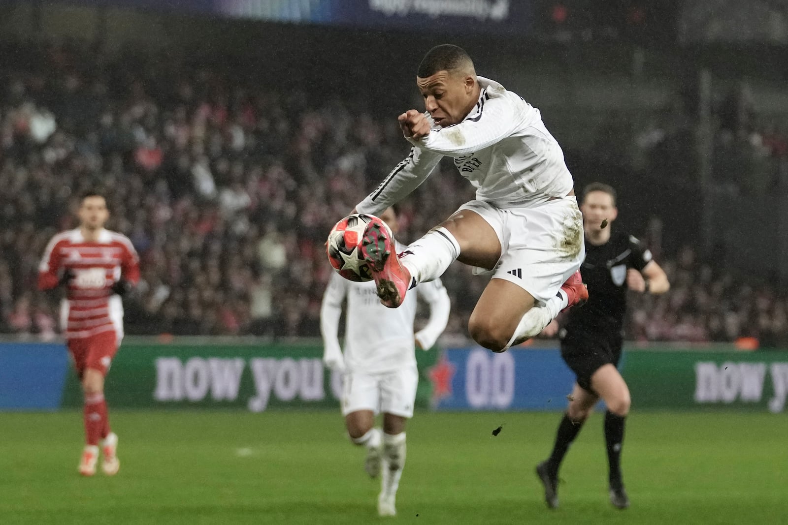 Real Madrid's Kylian Mbappe controls the ball during the Champions League opening phase soccer match between Brest and Real Madrid at Roudourou stadium in Guingamp, France, Wednesday, Jan. 29, 2025. (AP Photo/Thibault Camus)