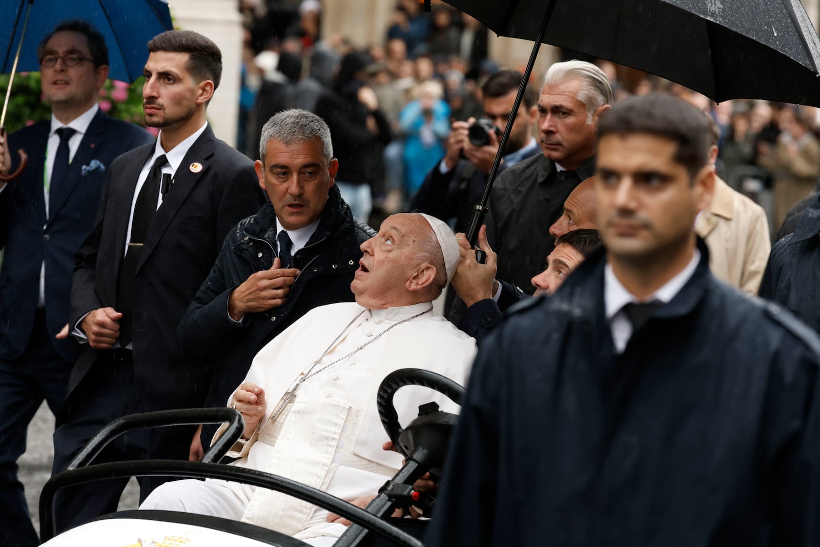 Pope Francis watches during a tours in an open car among the faithful in the Groet Markt in Leuven, Belgium, on the second day of his four-day visit to Luxembourg and Belgium, Friday, Sept. 27, 2024. (AP Photo/Omar Havana)