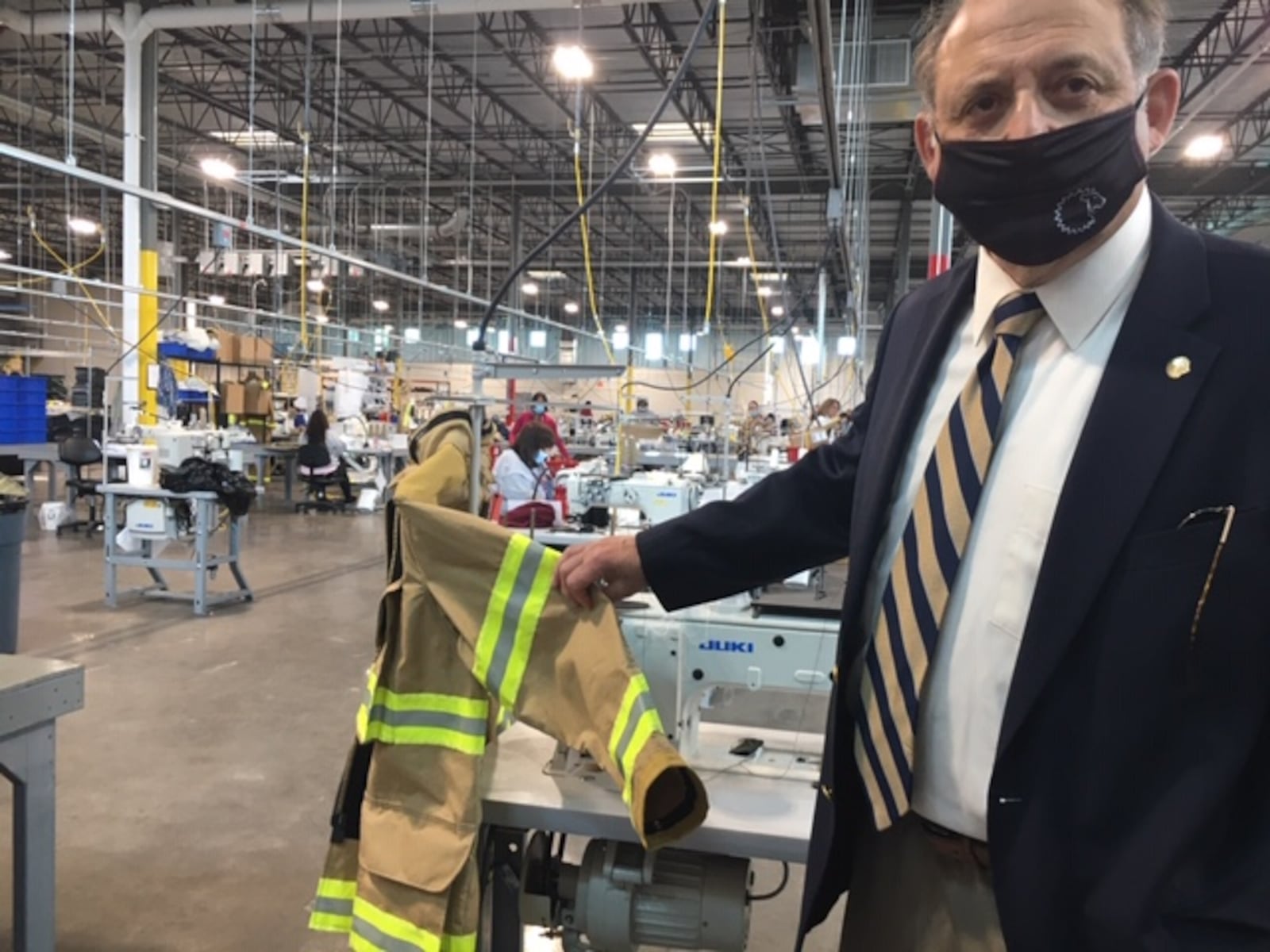 John Granby, Lion vice president, government relations & corporate responsibility, shows some of the gear produced at Lion's 66 Janney Road plant. THOMAS GNAU/STAFF