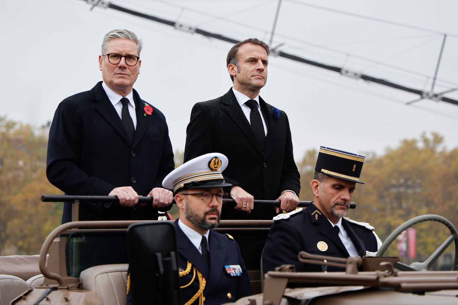 French President Emmanuel Macron, right, and Britain's Prime Minister Keir Starmer look on upon their arrival on the Place de l'Etoile to attend commemorations marking the 106th anniversary of the November 11, 1918, Armistice, ending World War I, in Paris, Monday, Nov. 11, 2024. ( Ludovic Marin, Pool via AP)