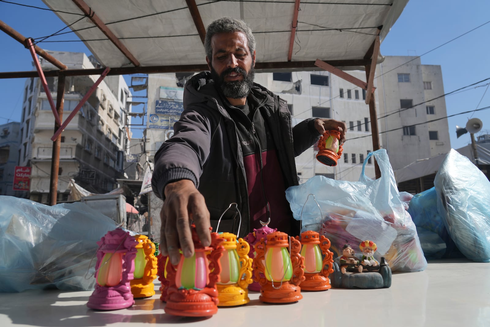 A Palestinian vendor displays lanterns ahead of the start of the Muslim holy month of Ramadan in Gaza City, Gaza Strip, Friday, Feb. 28, 2025. (AP Photo/Abdel Kareem Hana)