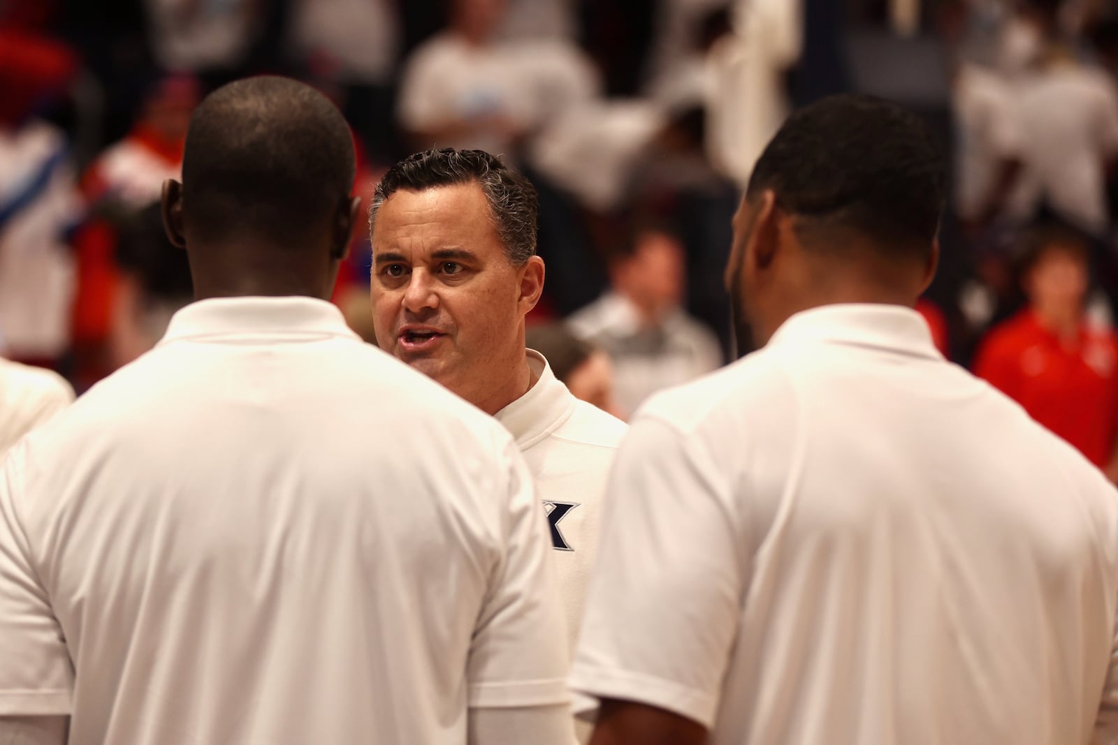 Xavier's Sean Miller talks to Dayton's Anthony Grant before an exhibition game on Sunday, Oct. 20, 2024, at UD Arena. David Jablonski/Staff