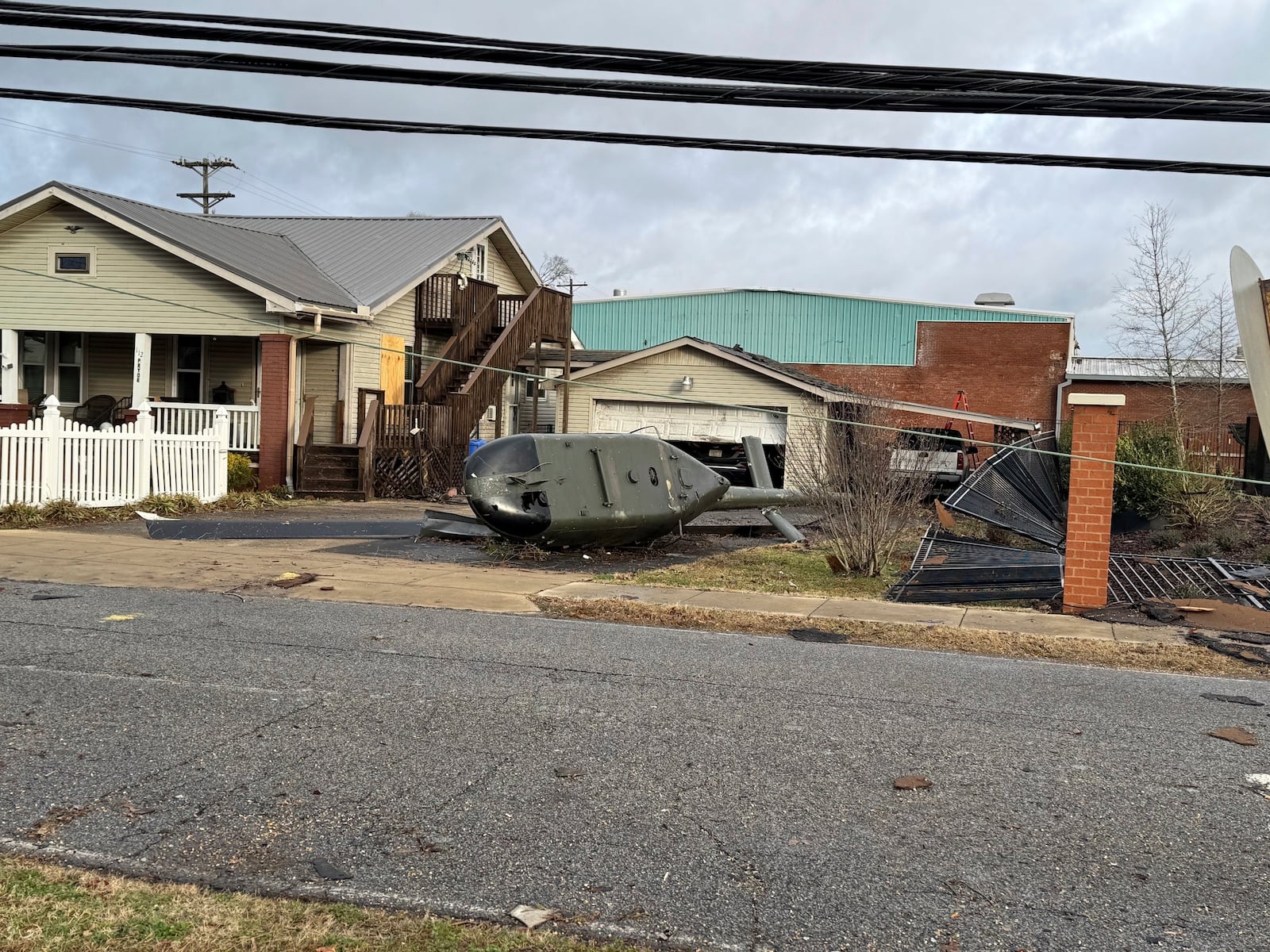 A military helicopter that was toppled from its perch in a military veterans park during a violent storm is seen on Sunday, Dec. 29, 2024, in Athens, Alabama. (AP Photo/Lance George)