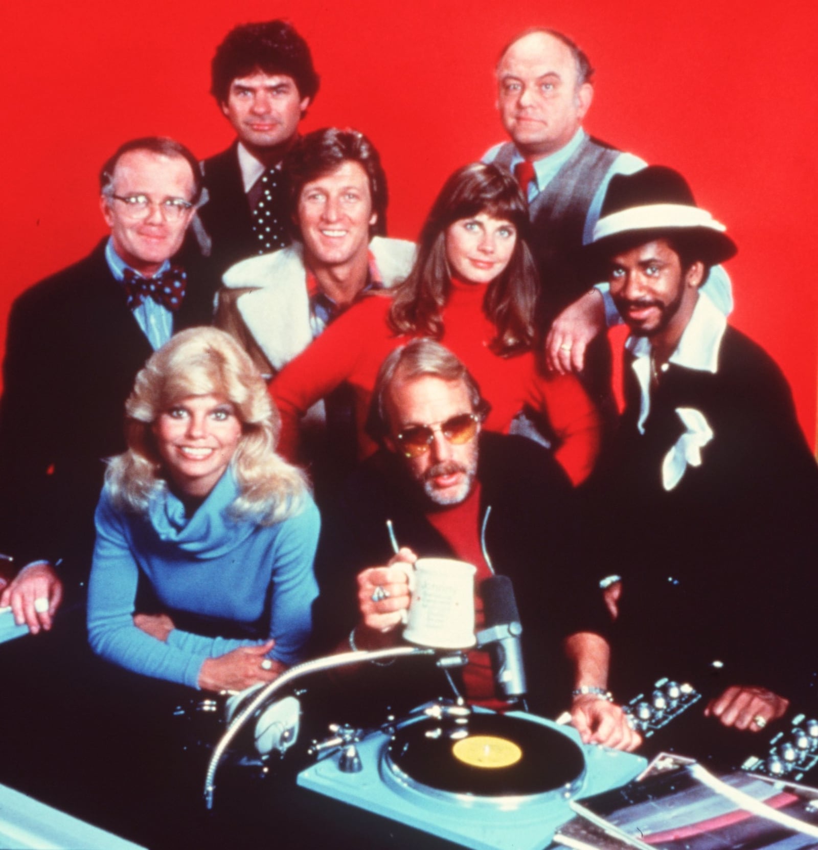 'WKRP' STARRING CLOCKWISE FROM LEFT: RICHARD SANDERS AS LES NESMAN, FRANK BONNER AS HERB TARLICK, GORDAN JUMP AS ARTHUR CARLSON, TIM REID AS VENUS FLYTRAP, HOWARD HESSEMAN AS DR. JOHNNIE FEVER, LONI ANDERSON AS JENNIFER, GARY SANDY AS ANDY AND JAN SMITHERS AS BAILEY.