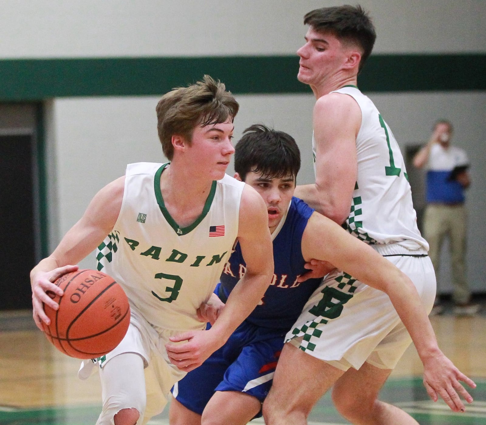 Josh Hegemann of Badin (with ball) uses a screen from teammate Spencer Giesting (right) to get past Sam Severt of Carroll. Badin defeated visiting Carroll 65-52 in a GCL Co-Ed boys high school basketball game on Friday, Dec. 20, 2019. MARC PENDLETON / STAFF