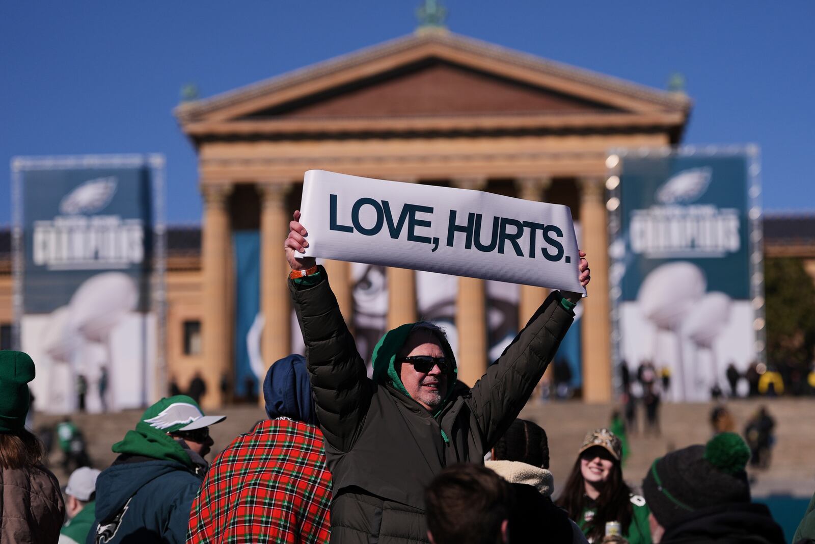 A Philadelphia Eagles holds up a sign during the Eagles' NFL football Super Bowl 59 parade and celebration, Friday, Feb. 14, 2025, in Philadelphia. (AP Photo/Matt Rourke)