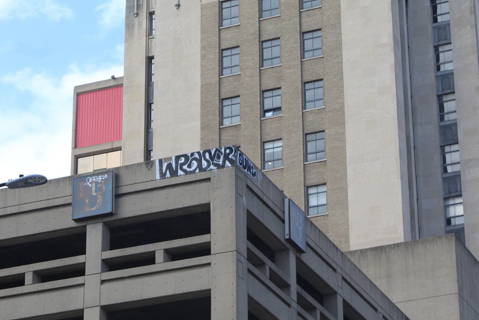 Graffiti on the top of a parking garage on Ludlow Street in downtown Dayton. CORNELIUS FROLIK / STAFF