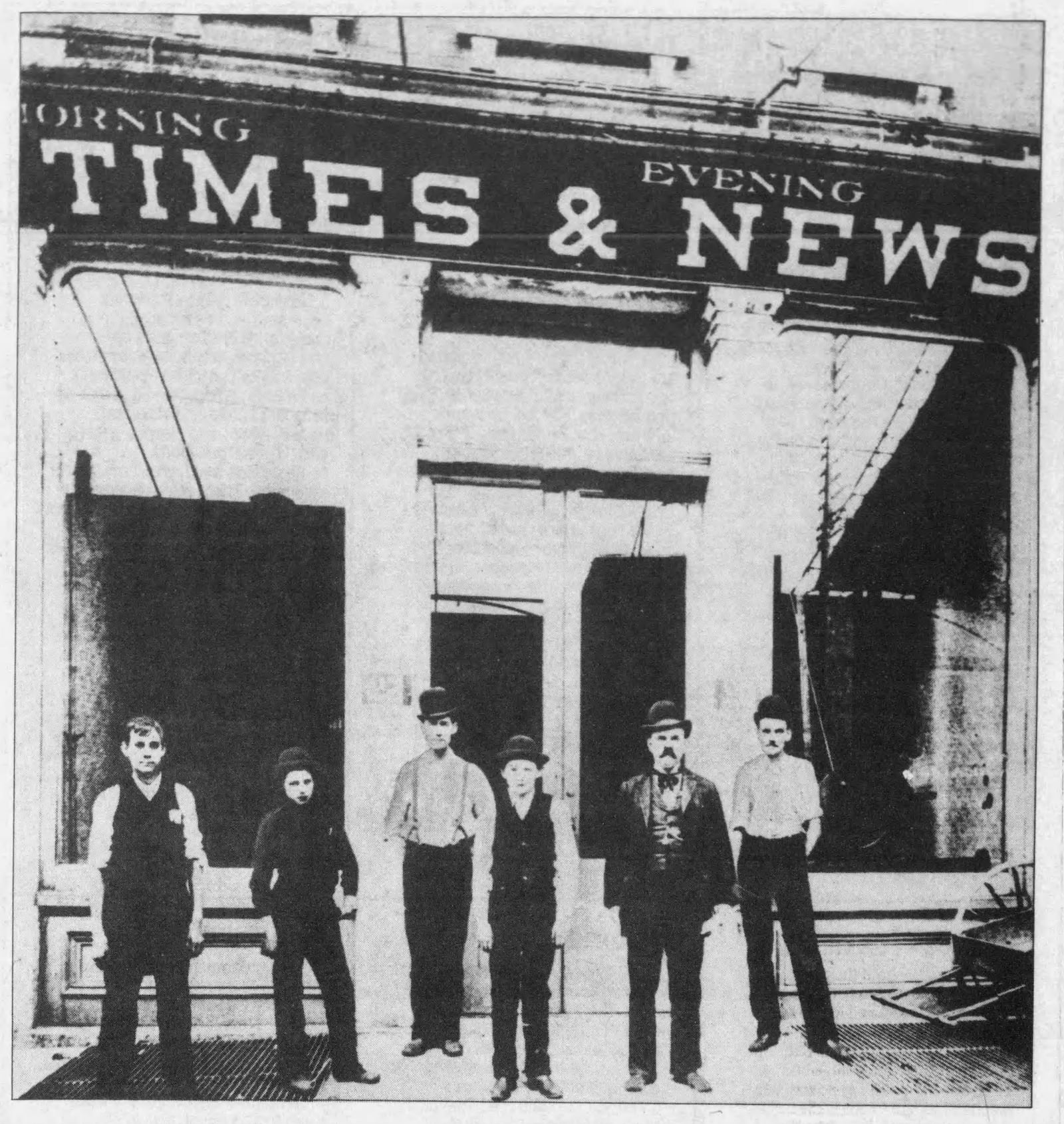 Employees posed for photos in front of the Evening News and Morning Times Building on 27 E. Second St. when James M. Cox took control of the publication in 1898. He renamed the paper the Dayton Daily News. DAYTON DAILY NEWS ARCHIVES