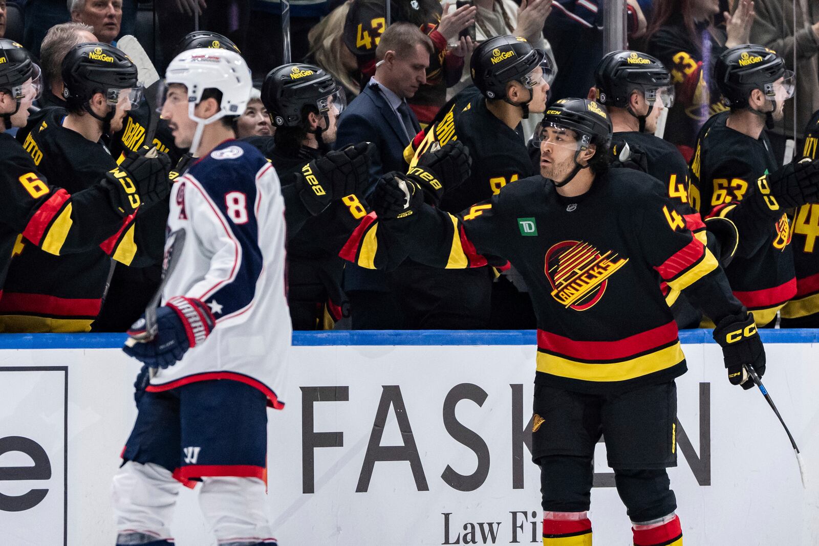 Vancouver Canucks' Kiefer Sherwood (44) celebrates his goal against the Columbus Blue Jackets during the second period of an NHL hockey game in Vancouver, British Columbia, Friday, Dec. 6, 2024. (Ethan Cairns/The Canadian Press via AP)