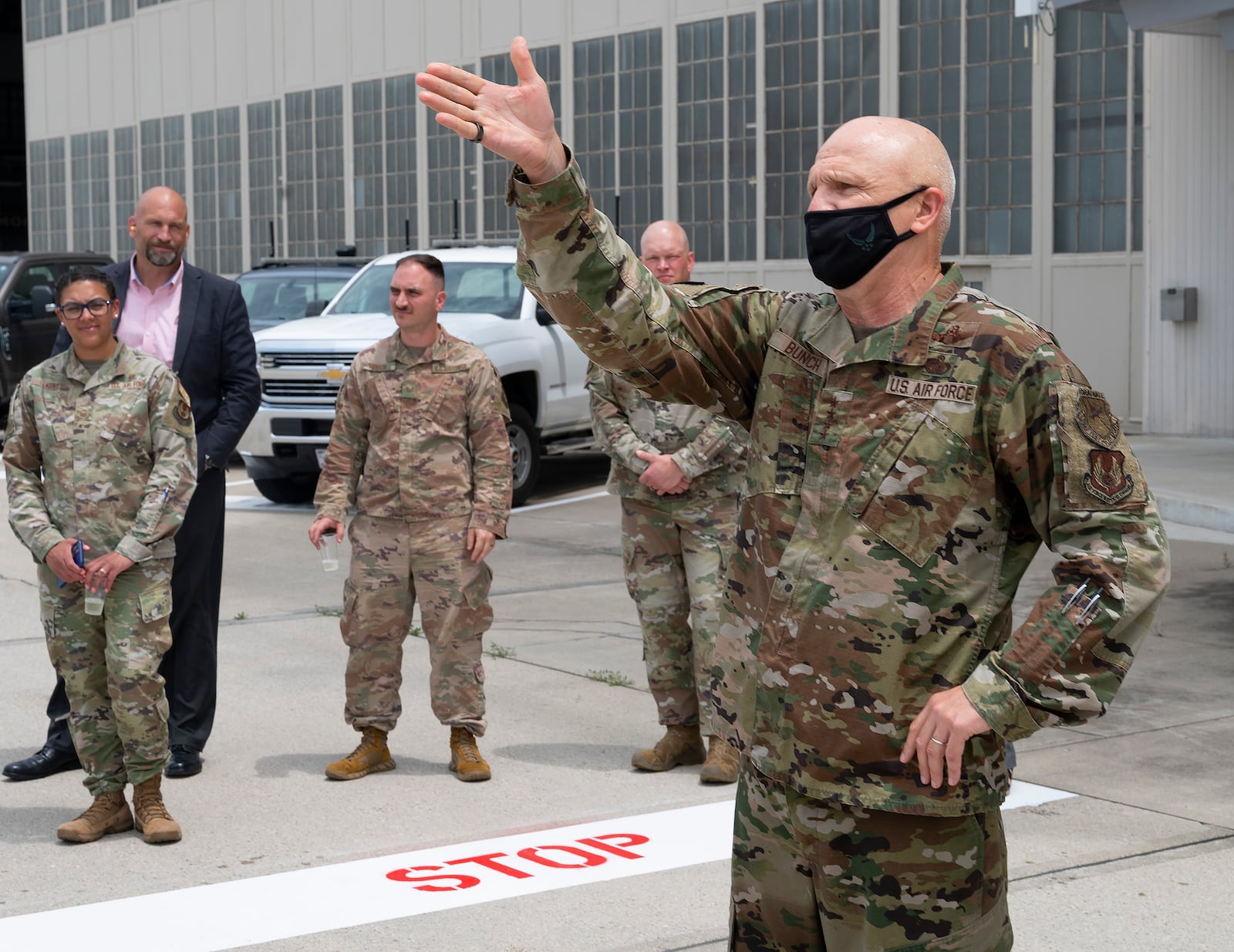 Gen. Arnold W. Bunch, Jr., retiring Air Force Materiel Command commander, thanks members of his headquarters staff, June 8, 2022, after his fini-flight at Wright-Patterson Air Force Base, Ohio. The fini-flight is an Air Force tradition where family, friends and coworkers hose down an aviator following his final flight. (U.S. Air Force photo by R.J. Oriez)
