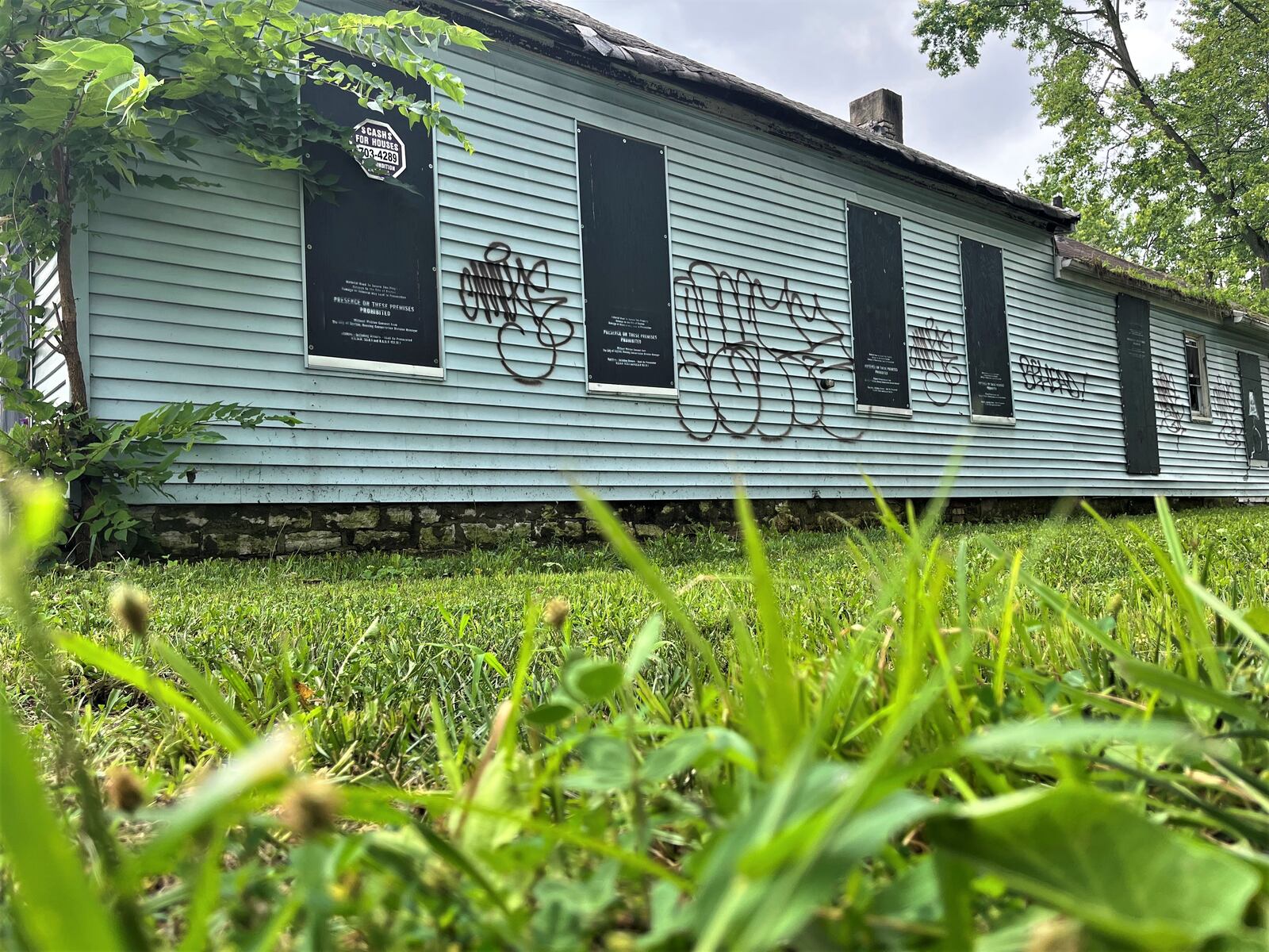 A vacant lot that the city of Dayton owns on the 100 block of Hawker Street. The city owns multiple empty lots on Hawker Street. CORNELIUS FROLIK / STAFF