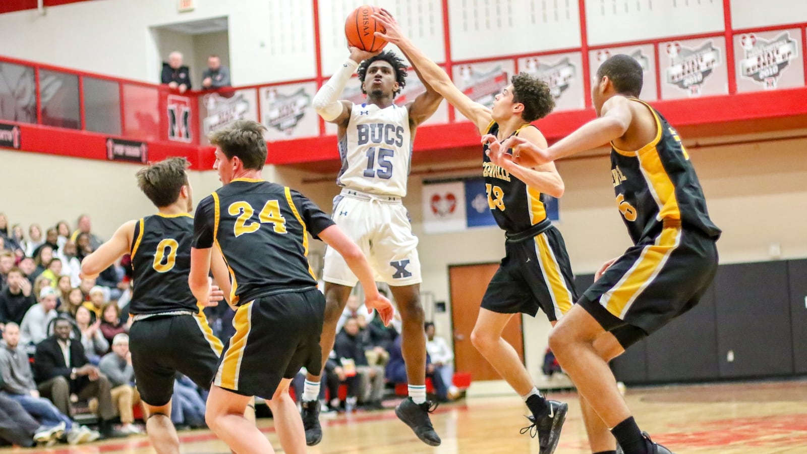 Xenia High School’s Samari Curtis shoots a jumper in front of Centerville’s Jason Sneed during during their Division I sectional final game on Friday night at Trotwood-Madison High School. The Elks won 63-51. CONTRIBUTED PHOTO BY MICHAEL COOPER