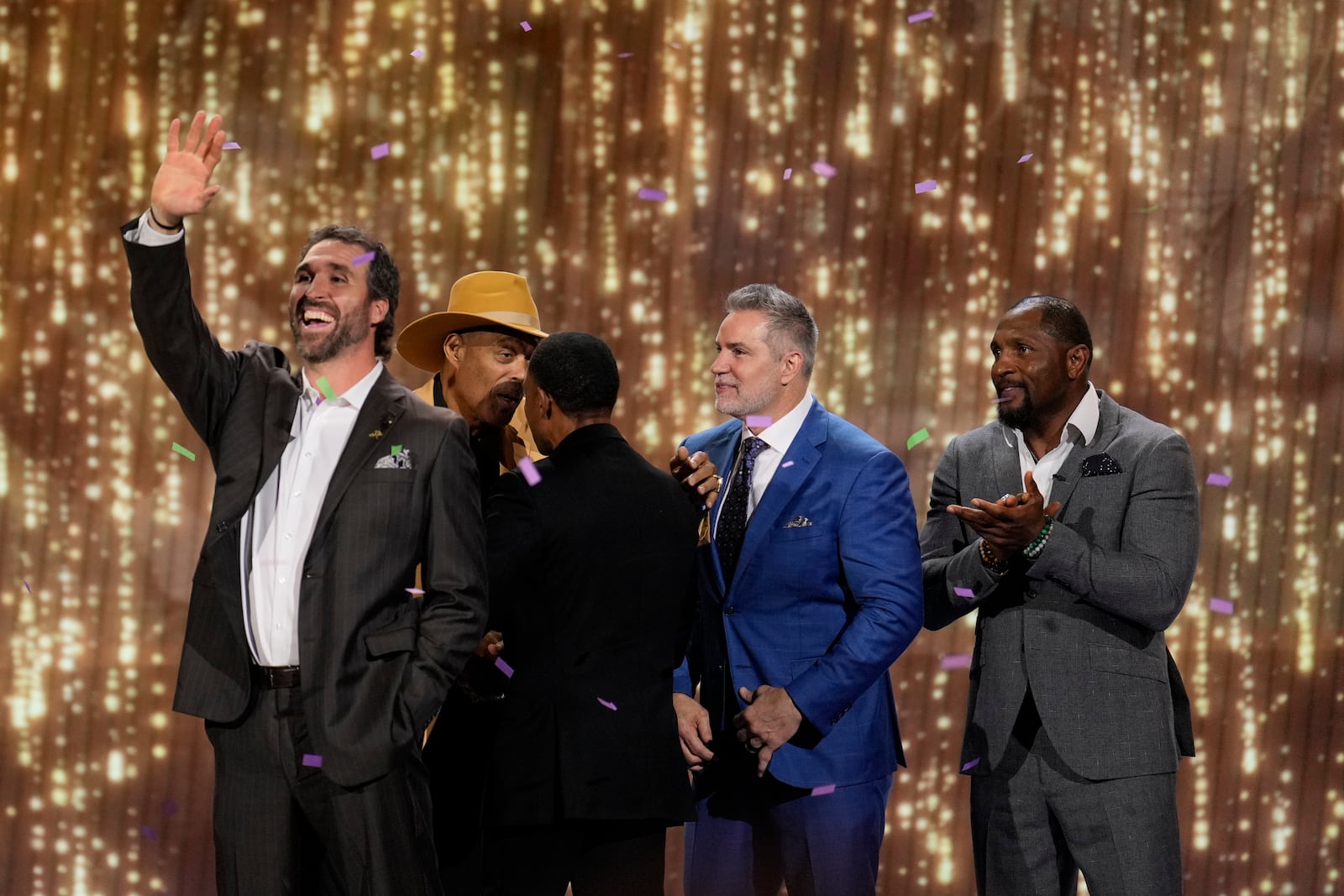 Minnesota Vikings' Jared Allen, former professional football player waves as he is introduced into the NFL Hall of Fame Class of 2025, during the NFL Honors award show ahead of the Super Bowl 59 football game, Thursday, Feb. 6, 2025, in New Orleans. (AP Photo/David J. Phillip)