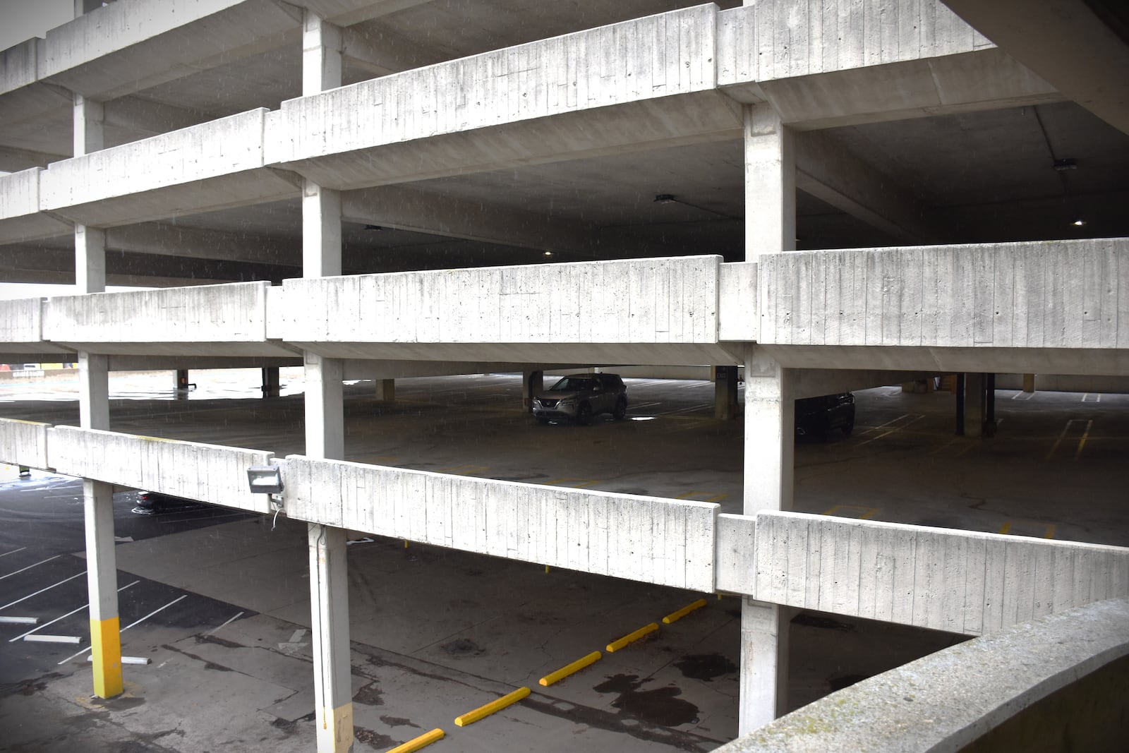 The Oregon District parking garage in downtown Dayton has 1,376 parking spaces. On Tuesday afternoon, only 63 spots were occupied by vehicles. Some people think downtown has far too much parking. CORNELIUS FROLIK / STAFF