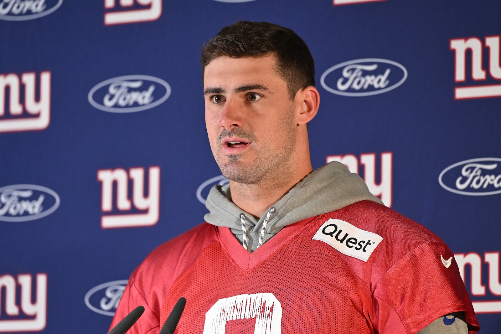 New York Giants quarterback Daniel Jones (8) attends a news conference after a practice session in Munich, Germany, Friday, Nov. 8, 2024. The New York Giants are set to play the Carolina Panthers in an NFL game at the Allianz Arena in Munich on Sunday. (AP Photo/Lennart Preiss)