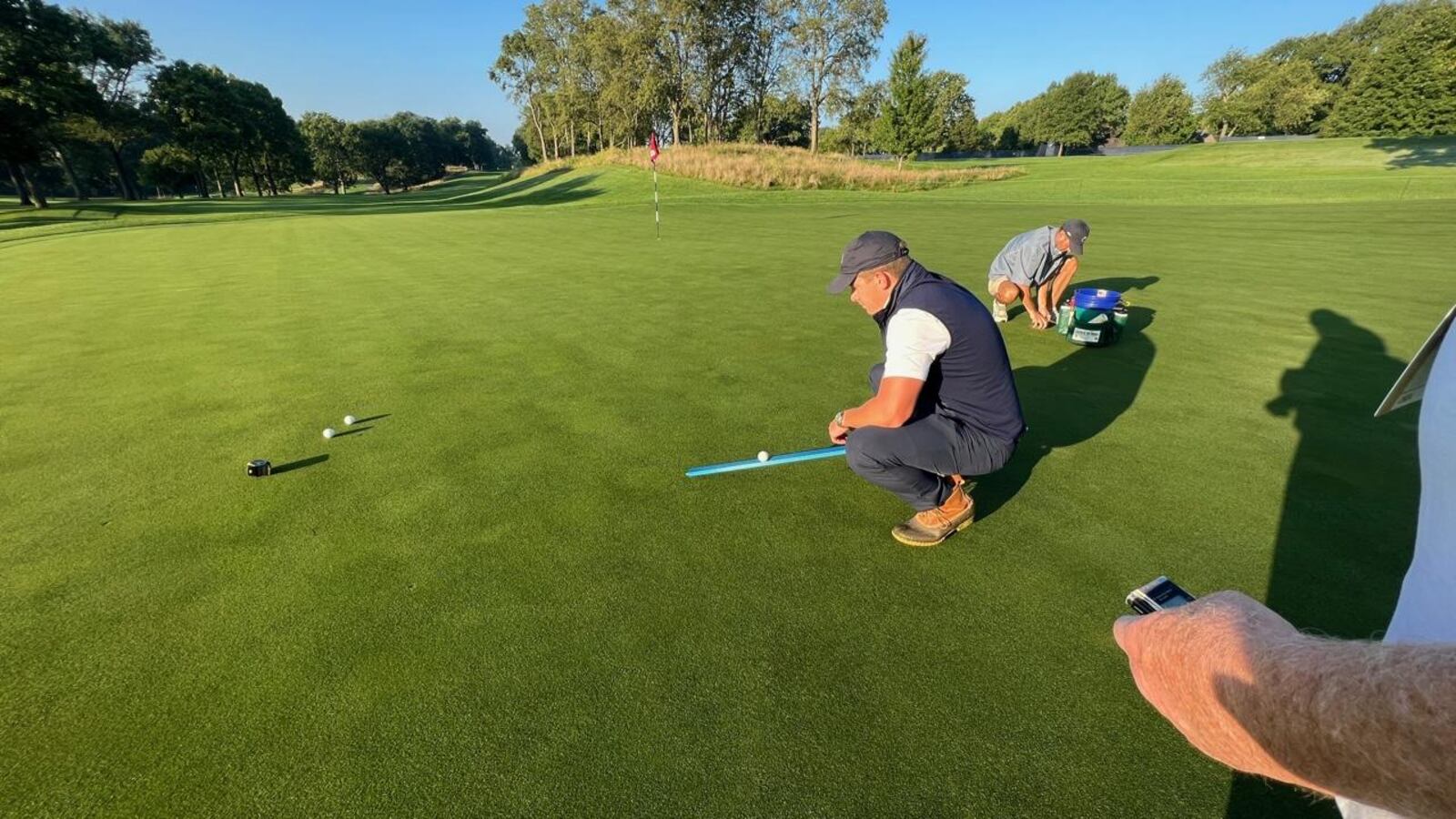 USGA agronomist Paul Jacobs uses a stimpmeter to determine the speed and consistency of the ninth green on NCR’s South Course early Saturday morning before the start of the third round of the U.S. Senior Women’s Open Championship. Jim Campion/CONTRIBUTED