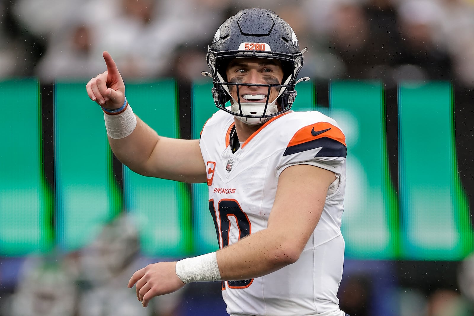 Denver Broncos quarterback Bo Nix (10) reacts after throwing his first touchdown pass against the New York Jets during the third quarter of an NFL football game, Sunday, Sept. 29, 2024, in East Rutherford, N.J. (AP Photo/Adam Hunger)