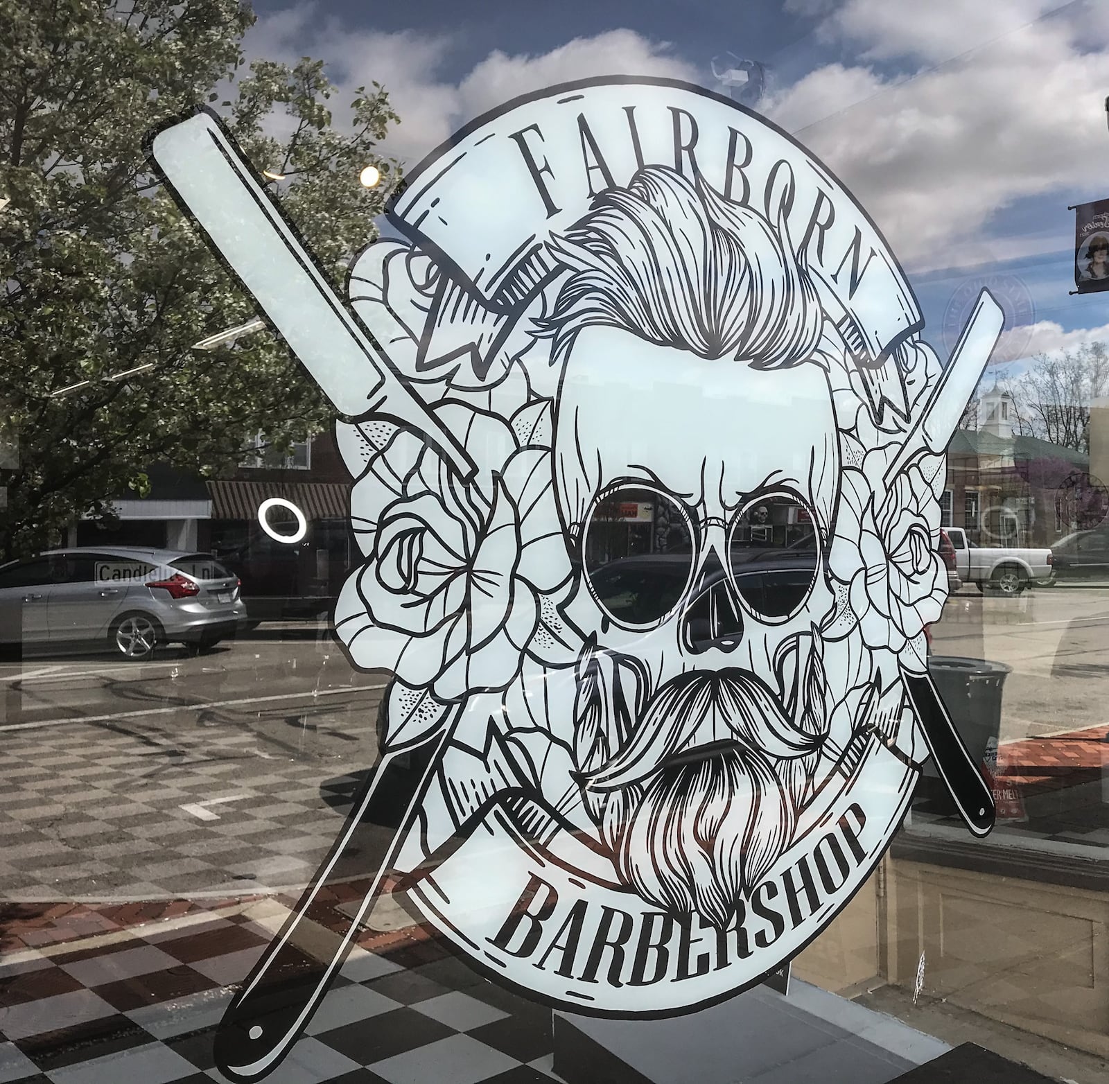 The front window of Fairborn Barber Shop on East Main St. in Fairborn. JIM NOELKER/STAFF