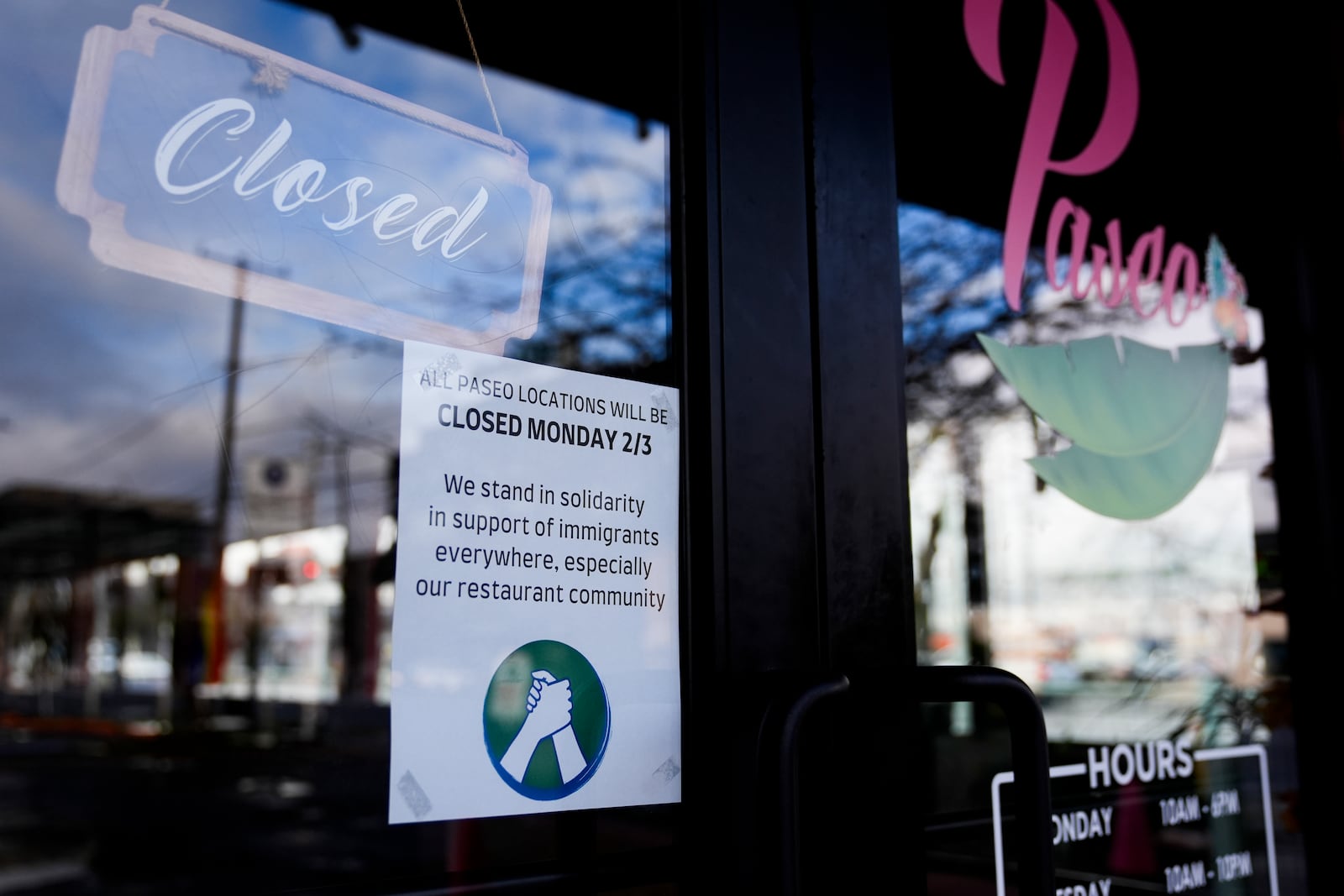 Paseo displays a sign stating the restaurant is closed for the day in solidarity to support the immigrant community, Monday, Feb. 3, 2025, in Seattle. (AP Photo/Lindsey Wasson)