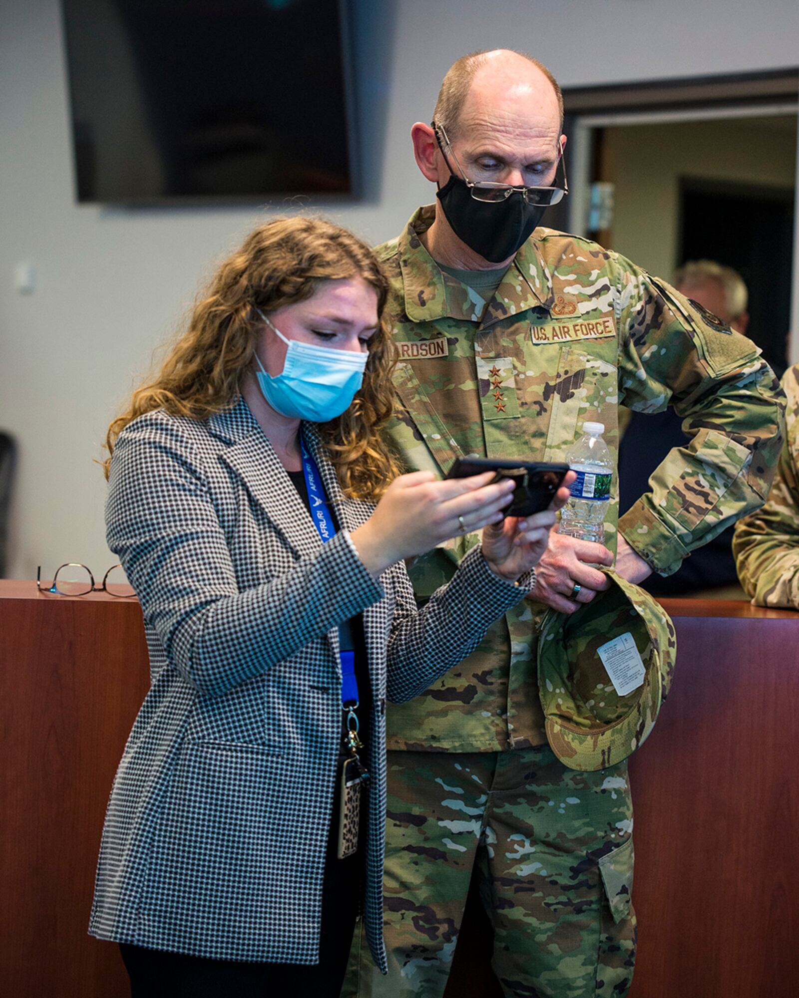 Gen. Duke Richardson, Air Force Materiel Command commander, watches as Sunshine Stacy, Air Force Research Laboratory program director, operates a drone from a mobile device Aug. 22 at Wright-Patterson Air Force Base. Richardson was given a demonstration of the base’s emergency-response common operating picture capabilities. U.S. AIR FORCE PHOTO/JAIMA FOGG