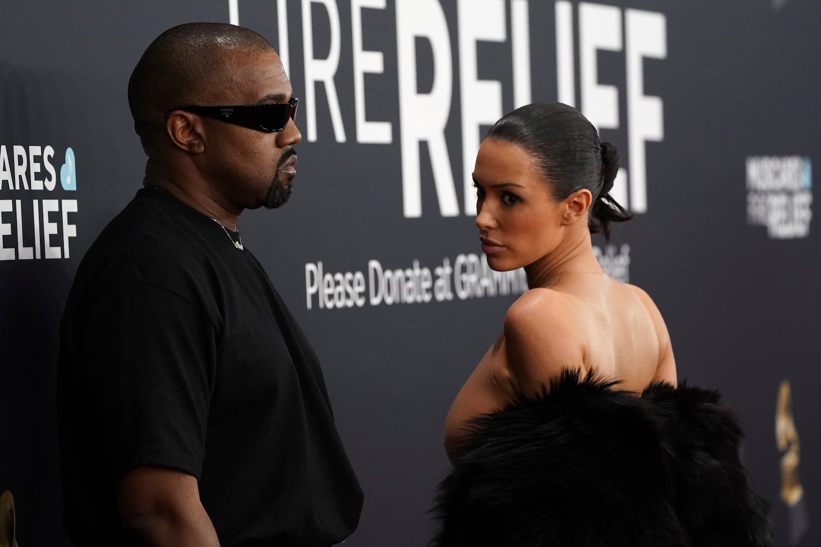 Kanye West, left, and Bianca Censori arrive at the 67th annual Grammy Awards on Sunday, Feb. 2, 2025, in Los Angeles. (Photo by Jordan Strauss/Invision/AP)