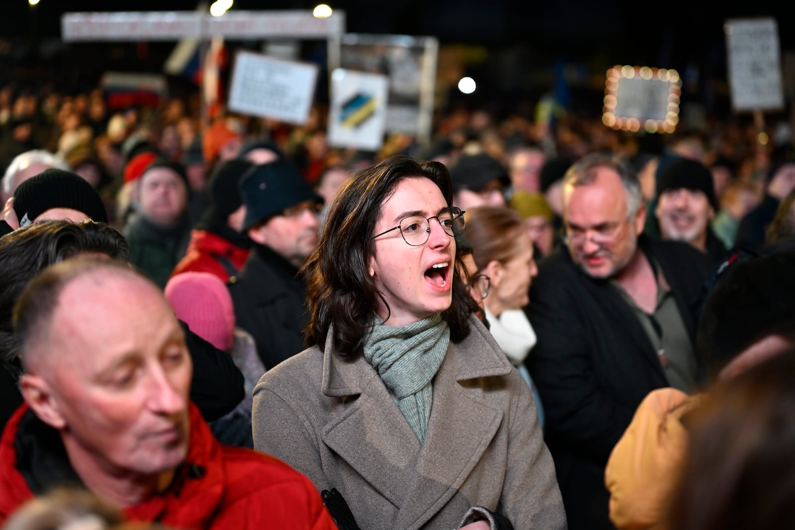 A protester shouts as thousands gather to oppose the policies of Slovakia's Prime Minister Robert Fico in Bratislava, Slovakia, Friday, Jan. 24, 2025. (AP Photo/Denes Erdos)