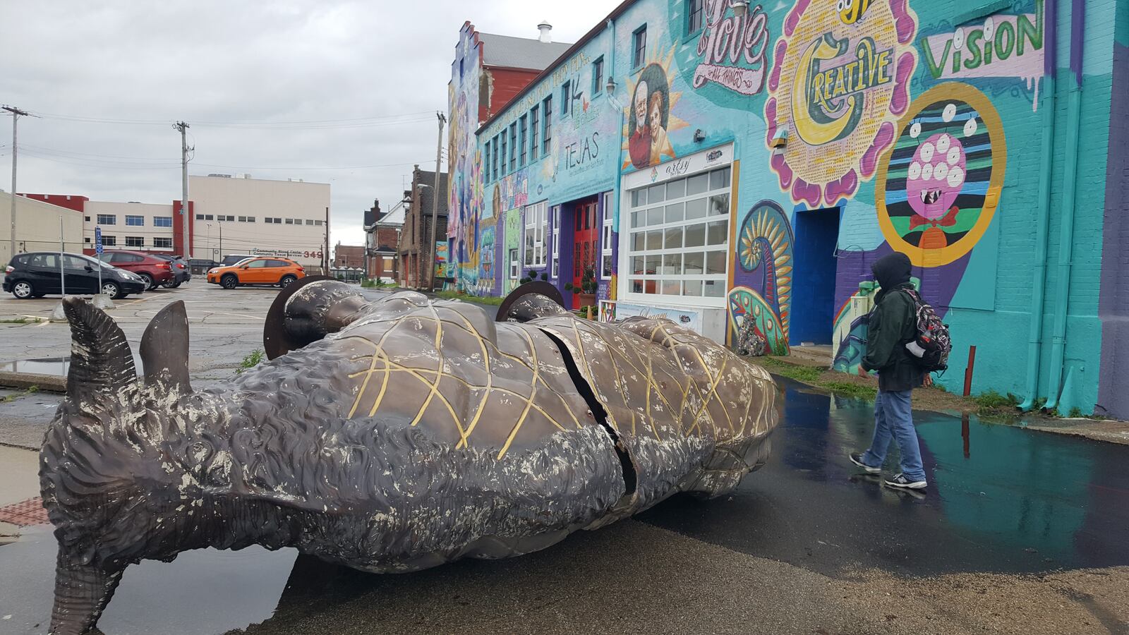 K12 Gallery and TEJAS said she is reviewing the footage from recently installed security cameras installed after vandalism issues to determine whether a large bison statue in front of their Jefferson Street gallery was blown over by the wind or knocked over. CONTRIBUTED