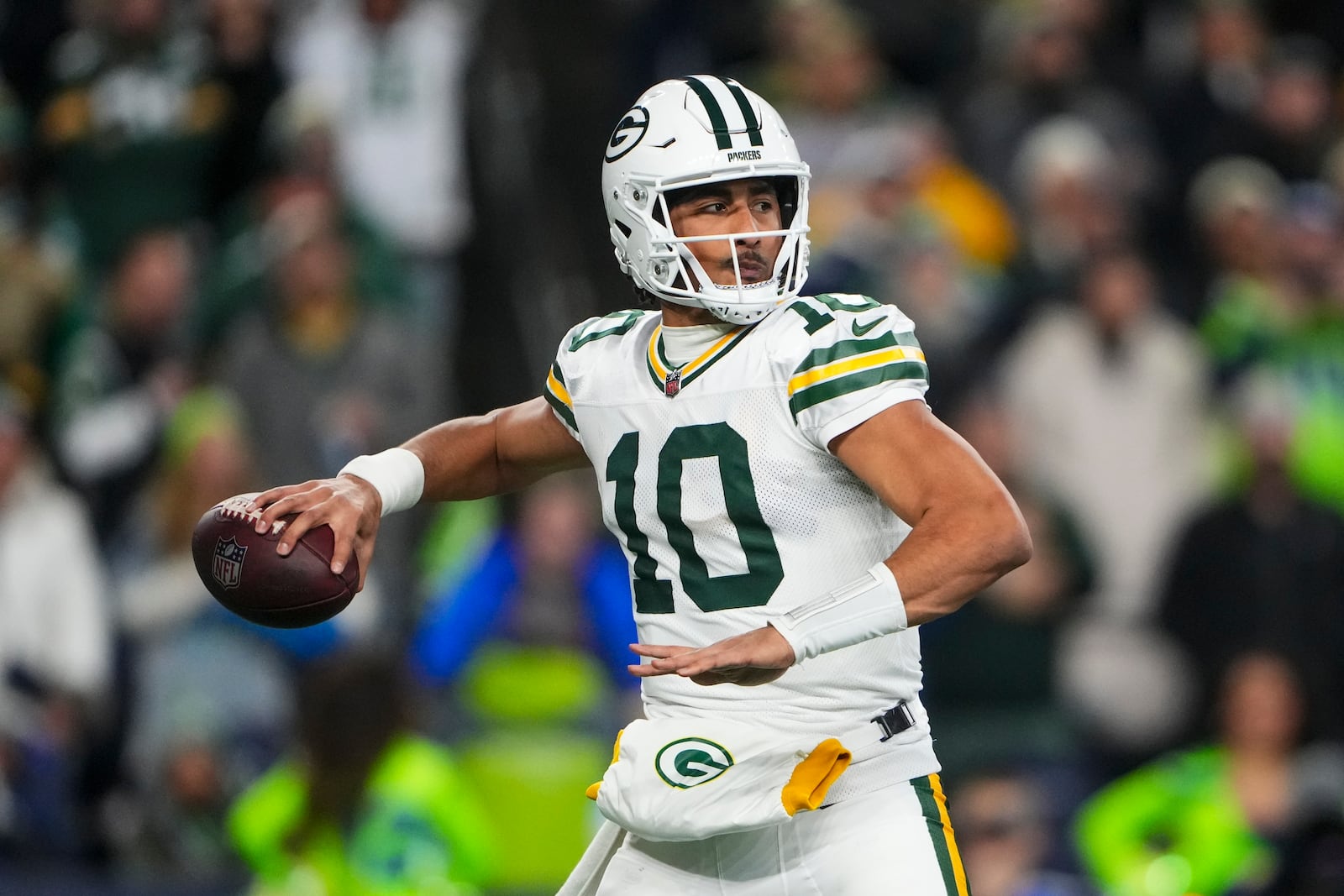 Green Bay Packers' Jordan Love throws during the first half of an NFL football game against the Seattle Seahawks Sunday, Dec. 15, 2024, in Seattle. (AP Photo/Lindsey Wasson)