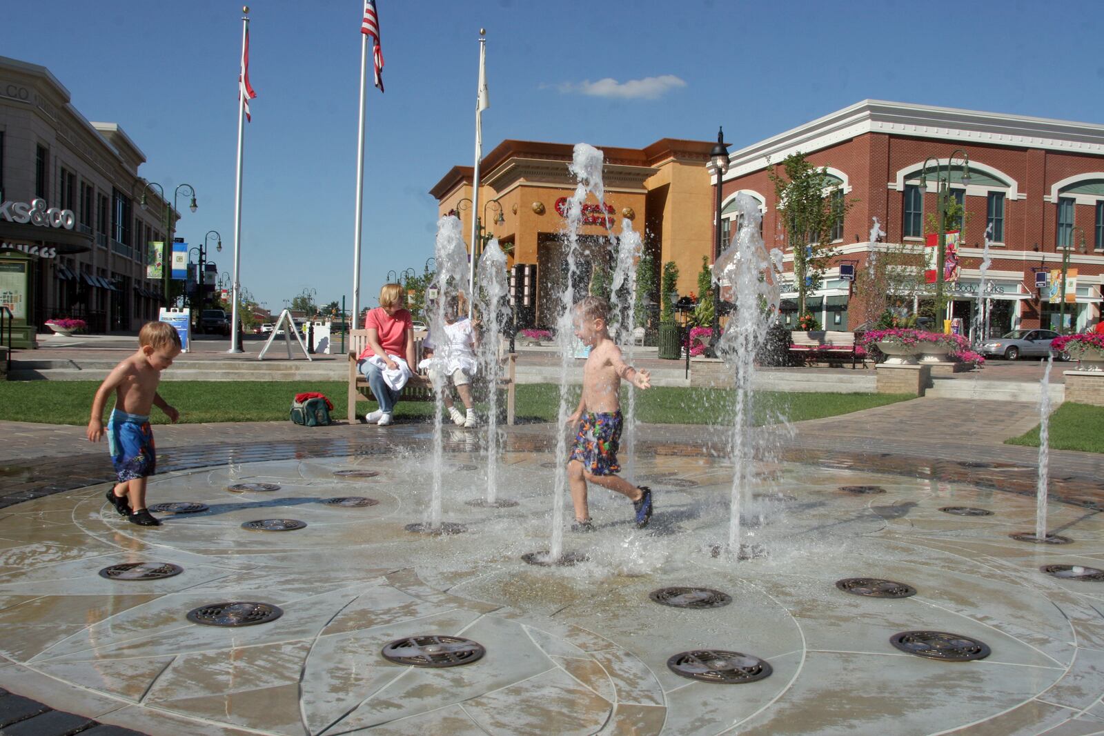 8/31/07 -- ddn090207salestax --Brian Knuth, 2, (left) and his brother Kyle, 3, of Atlanta play in the fountain at the the Greene while visiting his grandparents in Beavercreek with his family. PHOTO BY JAN UNDERWOOD