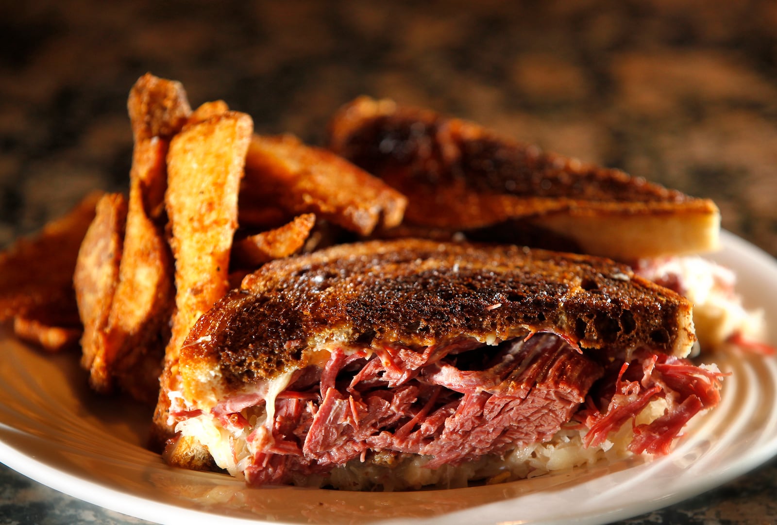 The Amber Rose Restaurant and Catering is a Dayton institution specializing in homemade Eastern European cuisine. On the menu is a tradition Rueben sandwich made with house cooked corned beef topped with saurkraut, swiss cheese, Thousand Island dressing on grilled rye. LISA POWELL / STAFF